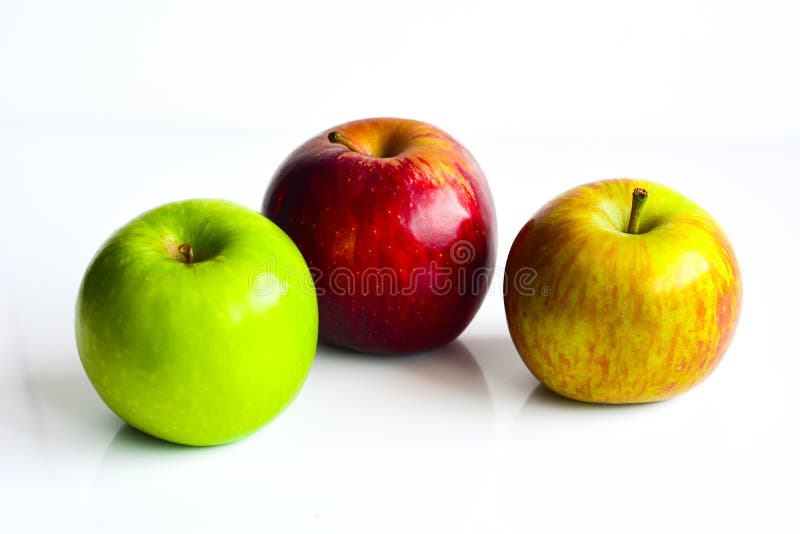 Colorful apples, red green and yellow fruit, isolated on white background. Health concept. Colorful apples, red green and yellow fruit, isolated on white background. Health concept.