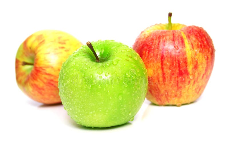 The ripe juicy apples covered by drops of water. Isolation on white, shallow DOF. The ripe juicy apples covered by drops of water. Isolation on white, shallow DOF.