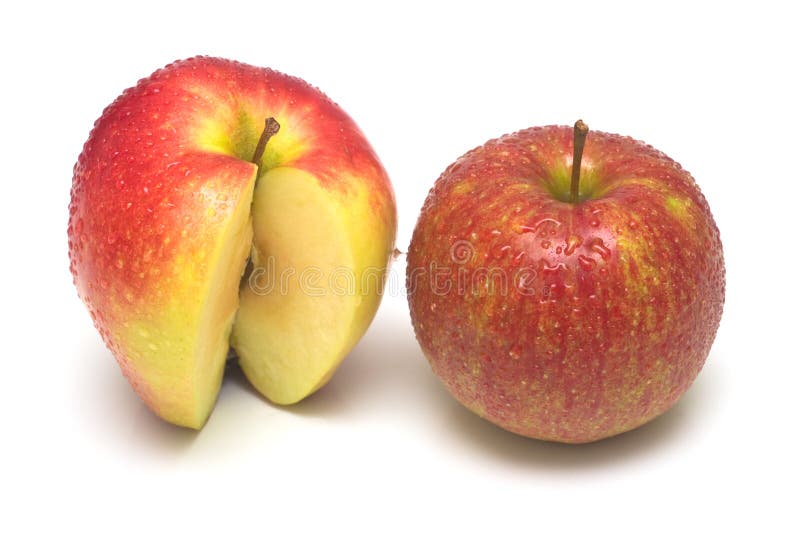 The red apples covered by drops of water on white. Isolation, shallow DOF. The red apples covered by drops of water on white. Isolation, shallow DOF.