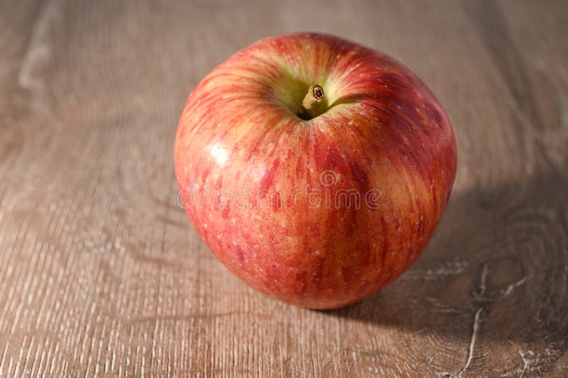 red apples on a wooden table 2. red apples on a wooden table 2