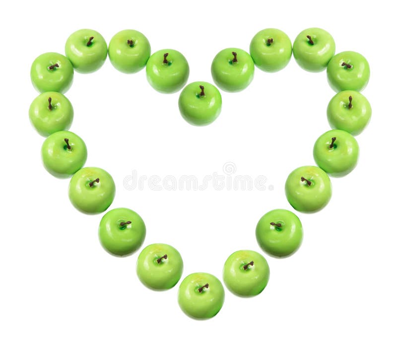 Manzanas verdes dispuestas en forma de corazón foto de archivo libre de regalías