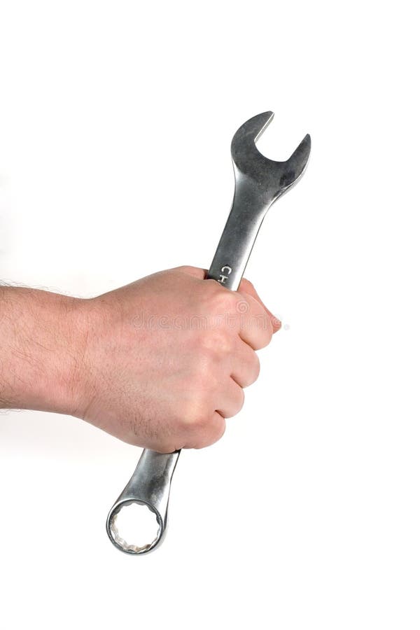 Manâ€™s hand holding a wrench