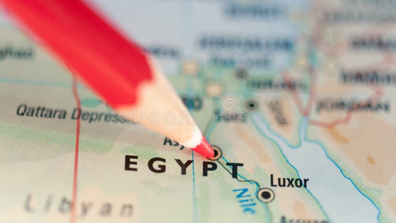 Political conflict or hot spot concept with red pencil pointing at the map of Egypt. Political conflict or hot spot concept with red pencil pointing at the map of Egypt