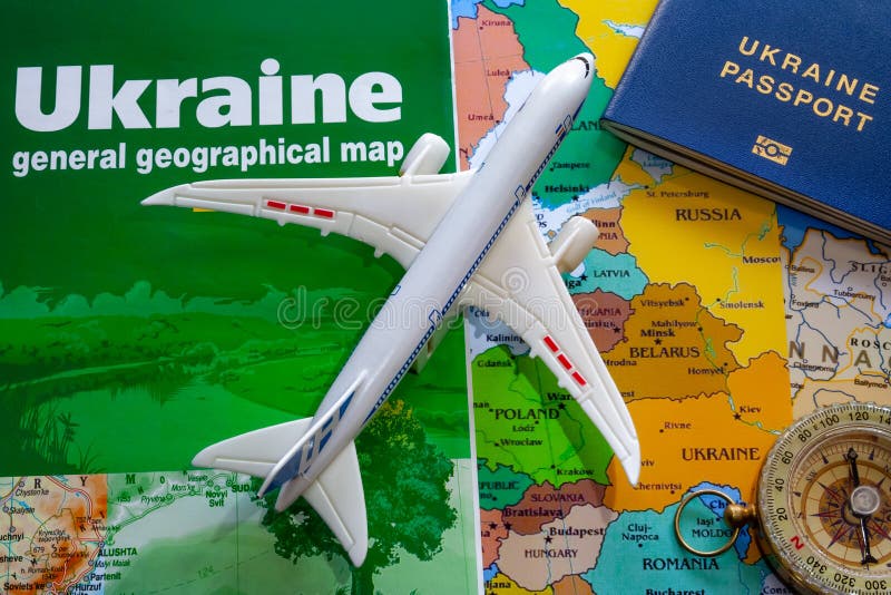 Map of Ukraine with a Passport and Plane Boeing for Travel Stock Photo