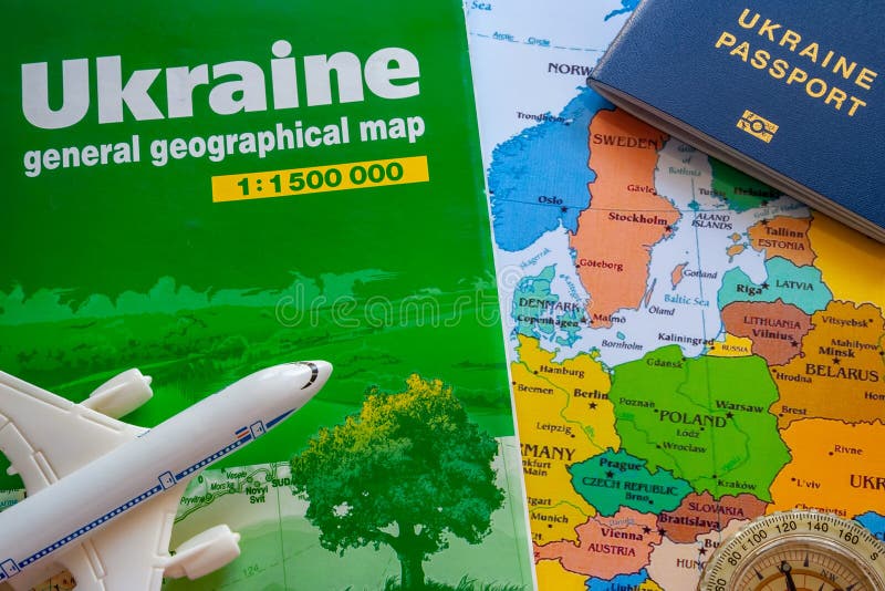 Map of Ukraine with a Passport and Plane Boeing for Travel Stock Photo