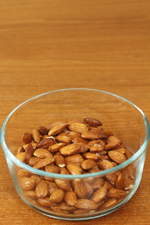 Maple Glazed Almonds in a Glass Bowl stock image Maple Glazed Almonds in a Glass Bowl stock image