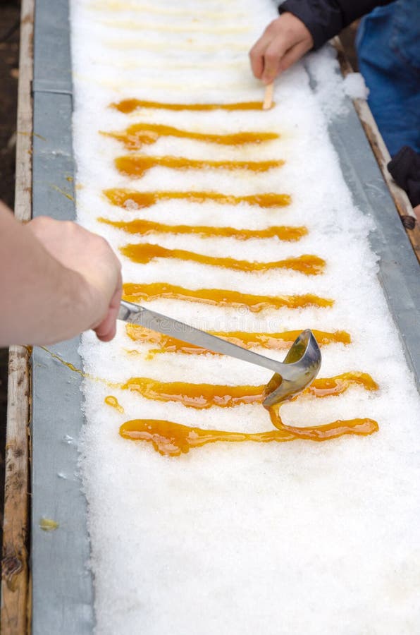 Maple taffy on snow royalty free stock photography