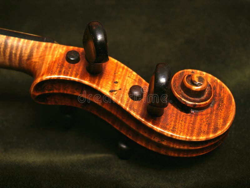 Antique Maple Violin Scroll on Olive Green Velvet