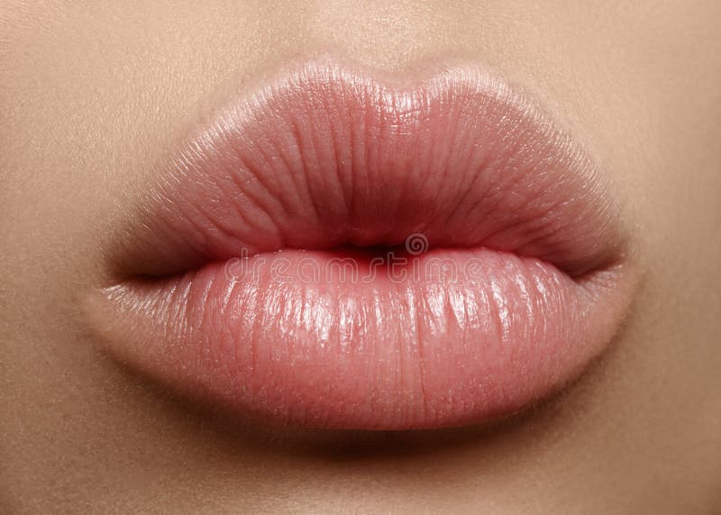 Close-up perfect natural lip makeup beautiful female mouth. Plump full lips. Macro photo face detail. Perfect clean skin, fresh lip make-up. Beautiful spa tender lips. Close-up perfect natural lip makeup beautiful female mouth. Plump full lips. Macro photo face detail. Perfect clean skin, fresh lip make-up. Beautiful spa tender lips