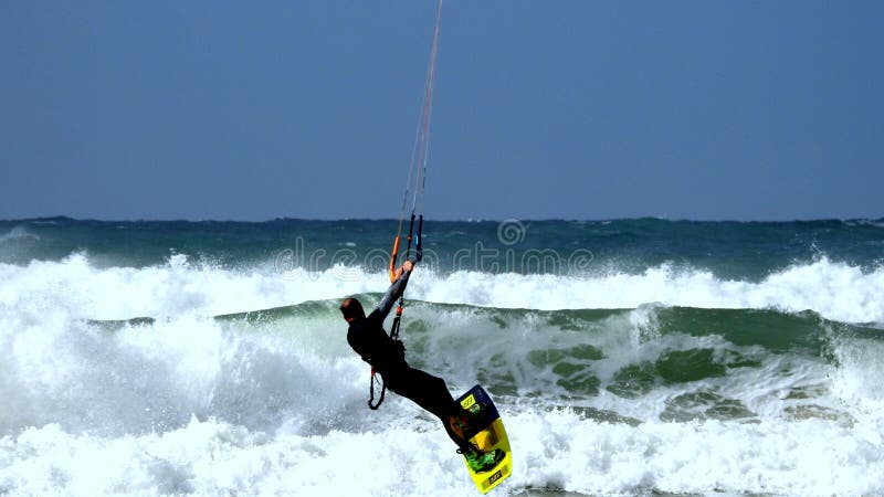 Mediterranean Sea. Israel. The coast near Haifa. The sea is storming. But there are daredevils who fly through the waves. Using a sail. Mediterranean Sea. Israel. The coast near Haifa. The sea is storming. But there are daredevils who fly through the waves. Using a sail.