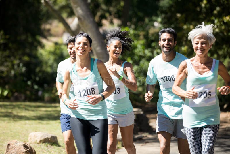 Marathon athletes running in the park stock photo Marathon athletes running in the park stock photo