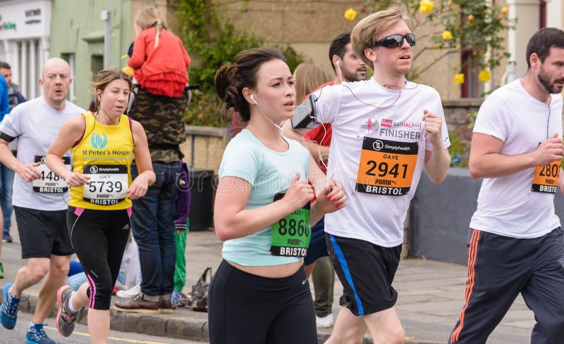 Marathon Runners X12. England, Bristol - May 7, 2017: Marathon Runners X12, Simplyhealth Great Bristol 10k, Shallow Depth of Field royalty free stock images Marathon Runners X12. England, Bristol - May 7, 2017: Marathon Runners X12, Simplyhealth Great Bristol 10k, Shallow Depth of Field royalty free stock images