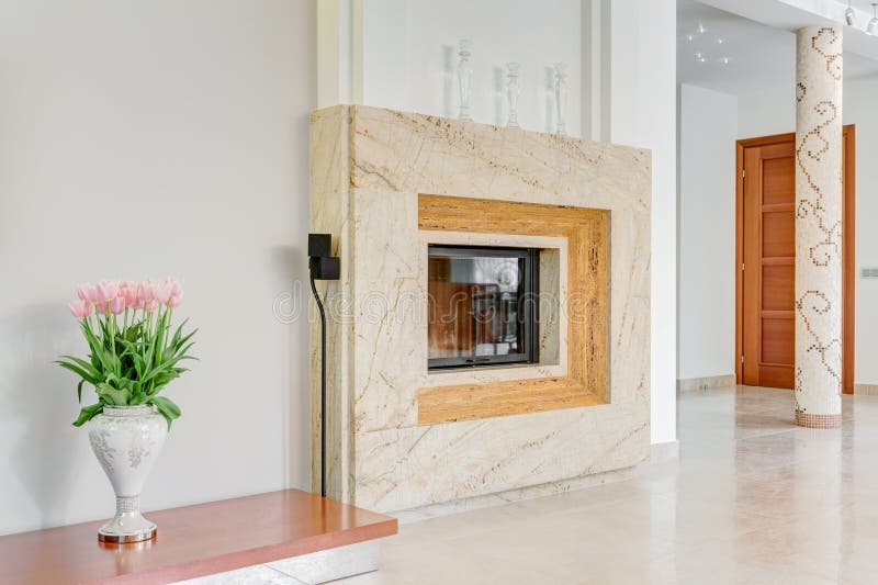 Close up of stylish marble fireplace in lounge