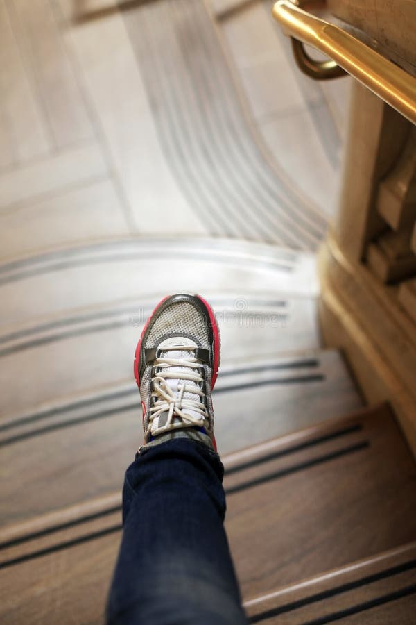 Image of female leg going along marble ladder in office building. Female climbing high risk building stock images, royalty-free photos and pictures