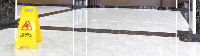 Marble shiny floor in a luxury hallway of company or hotel during cleaning stock image Marble shiny floor in a luxury hallway of company or hotel during cleaning stock image