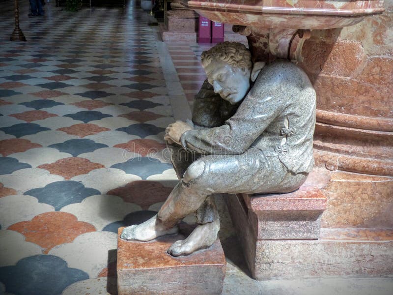 Marble statue of a man holding the holy water stoup of the church of San Anastaisa to Verona in Italy. stock image Marble statue of a man holding the holy water stoup of the church of San Anastaisa to Verona in Italy. stock image