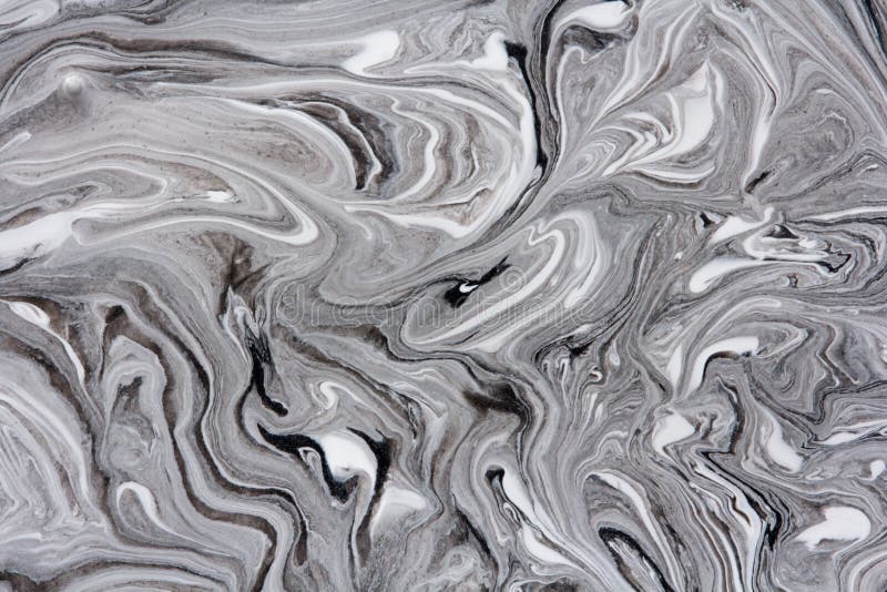 marble texture formed by mixing the black and white acrylic paint, abstract  background Stock Photo