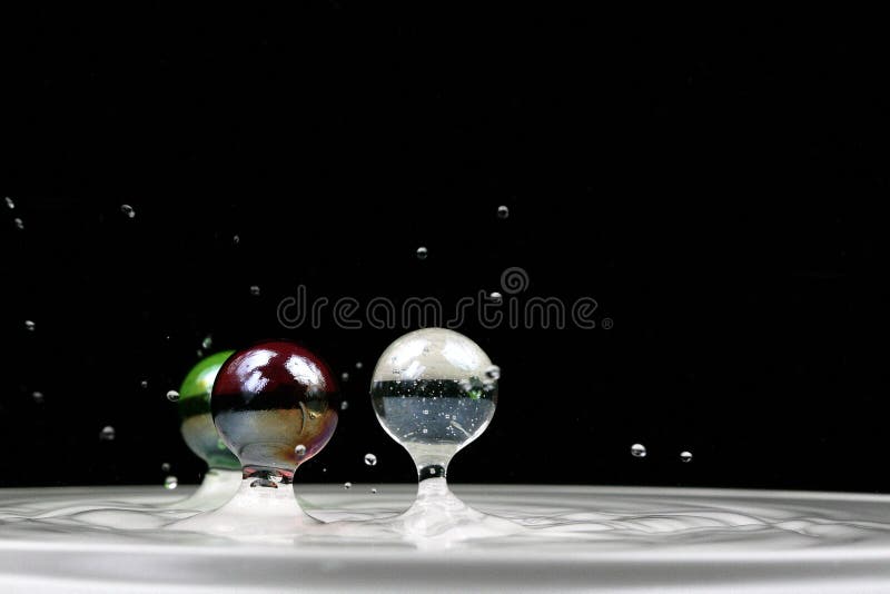 Marbles in water splash stock photo. Image of colorful 21923060