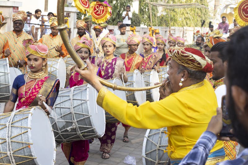 02 March 2023, Ahwa(Dang), Gujarat-India, Tribal Festival of Dang Gujarat. Man with the Traditional clarinet and Beautiful Indian Woman with Drums in the festival of tribal people in Dang Gujarat. 02 March 2023, Ahwa(Dang), Gujarat-India, Tribal Festival of Dang Gujarat. Man with the Traditional clarinet and Beautiful Indian Woman with Drums in the festival of tribal people in Dang Gujarat