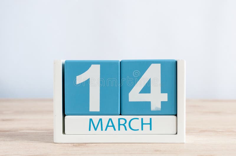 March 14th. Day 14 of Month, daily Calendar on Wooden Table Background