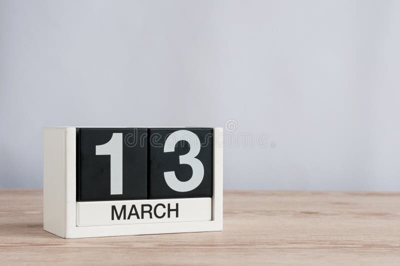 March 13th. Day 13 of month, wooden calendar on light background. Spring time, empty space for text stock photos March 13th. Day 13 of month, wooden calendar on light background. Spring time, empty space for text stock photos
