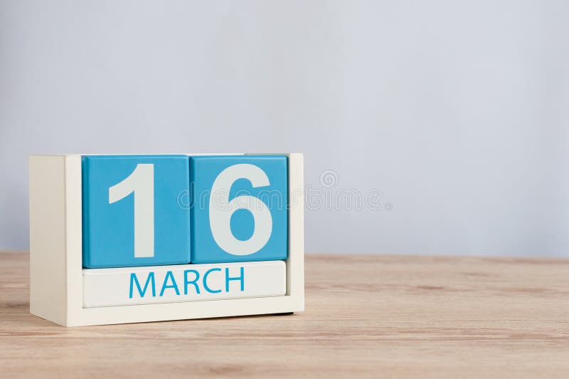 March 16th. Day 16 of Month, Calendar on Blue Wooden Table Background