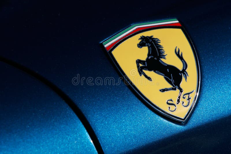 Ferrari logo on blue sport car, Cavallino Rampante badge. Ferrari logo on blue sport car, Cavallino Rampante badge