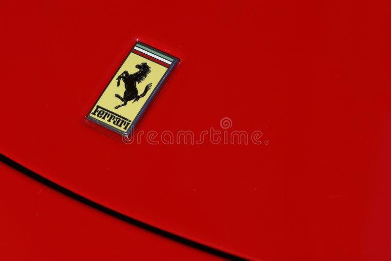 Ferrari logo on red sport car, Cavallino Rampante badge. Ferrari logo on red sport car, Cavallino Rampante badge