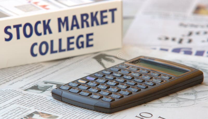 Calculator on financial newspaper and stock market box. Calculator on financial newspaper and stock market box