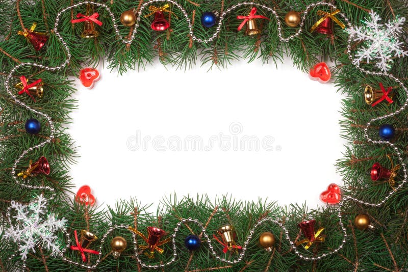 Marco de la Navidad hecho de las ramas del abeto adornadas con las campanas y de las bolas aisladas en el fondo blanco foto de archivo libre de regalías Marco de la Navidad hecho de las ramas del abeto adornadas con las campanas y de las bolas aisladas en el fondo blanco foto de archivo libre de regalías