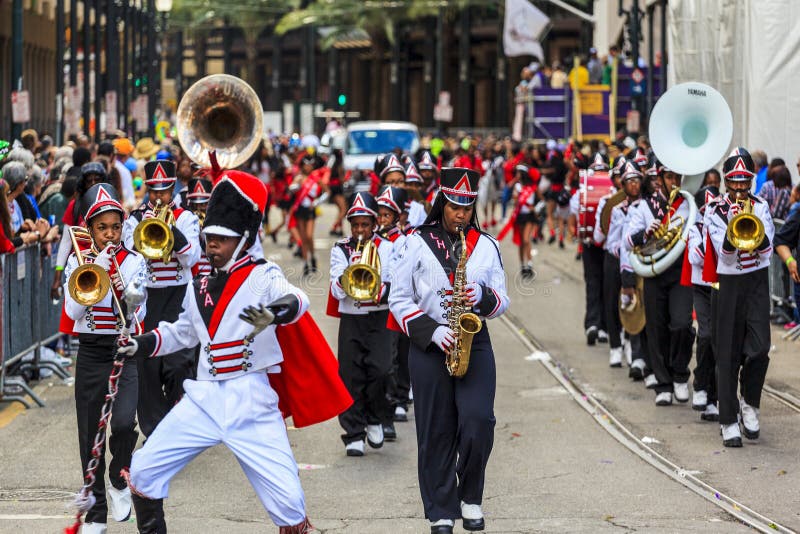 NEW ORLEANS USA FEB 1 2016: Mardi Gras parades through the streets of New Orleans.People celebrated crazily. Mardi Gras is the biggest celebration the city of New Orleans hosts every year. NEW ORLEANS USA FEB 1 2016: Mardi Gras parades through the streets of New Orleans.People celebrated crazily. Mardi Gras is the biggest celebration the city of New Orleans hosts every year.