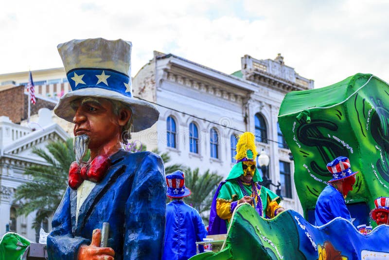 NEW ORLEANS USA FEB 1 2016: Mardi Gras parades through the streets of New Orleans.People celebrated crazily. Mardi Gras is the biggest celebration the city of New Orleans hosts every year. NEW ORLEANS USA FEB 1 2016: Mardi Gras parades through the streets of New Orleans.People celebrated crazily. Mardi Gras is the biggest celebration the city of New Orleans hosts every year.