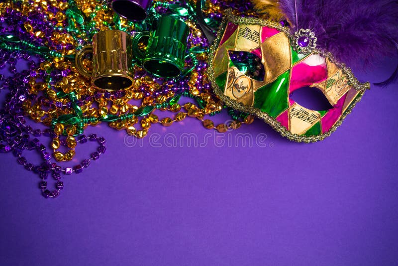 Mardi Gras or Carnivale mask on a purple backgroun