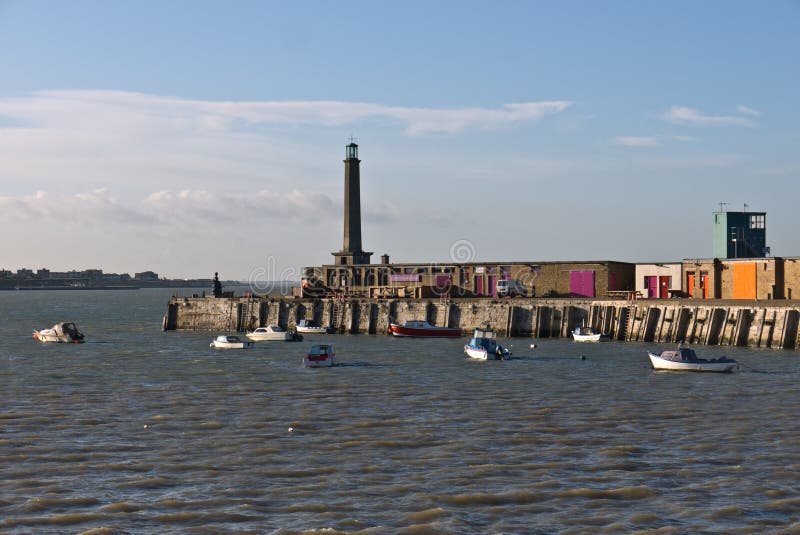 Margate Harbour and lighthouse at high tide.