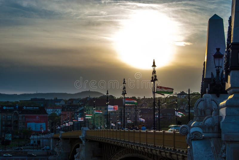 Margit or Margaret Bridge in Budapest, Hungary. It connects Buda and Pest across the Danube. Against spectacular sunset. Margit or Margaret Bridge in Budapest, Hungary. It connects Buda and Pest across the Danube. Against spectacular sunset.