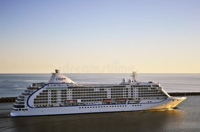 KLAIPEDA,LITHUANIA- JULY 03:Cruise liner Seven Seas Voyager in port Klaipeda on July 03,2014, Lithuania. Seven Seas Voyager is a cruise ship for Regent Seven Seas Cruises. KLAIPEDA,LITHUANIA- JULY 03:Cruise liner Seven Seas Voyager in port Klaipeda on July 03,2014, Lithuania. Seven Seas Voyager is a cruise ship for Regent Seven Seas Cruises.