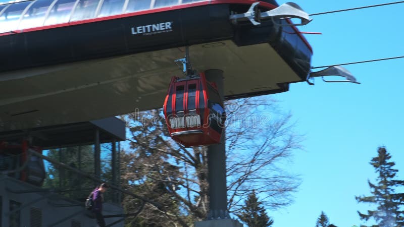 Red cable car arrives at top station at Bellevue on Pohorje, near Maribor