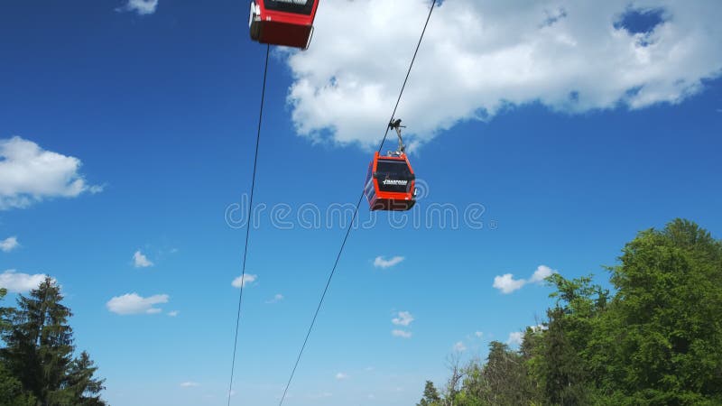 Red cable cars in summer, cableway on Pohorje mountain, near Maribor, Slovenia