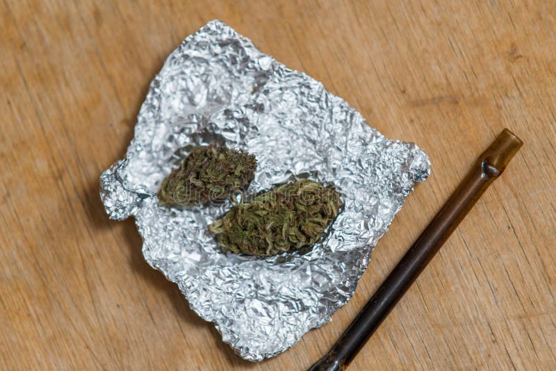 Marijuana in Tin Foil with Pipe on Wooden Table Stock Photo Image of care, herb 80085430