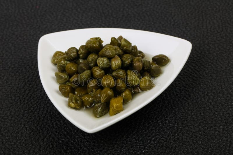 Capers in the bowl royalty free stock photos
