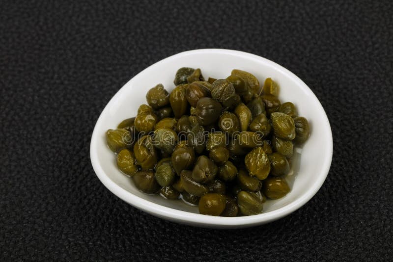 Capers in the bowl stock photography