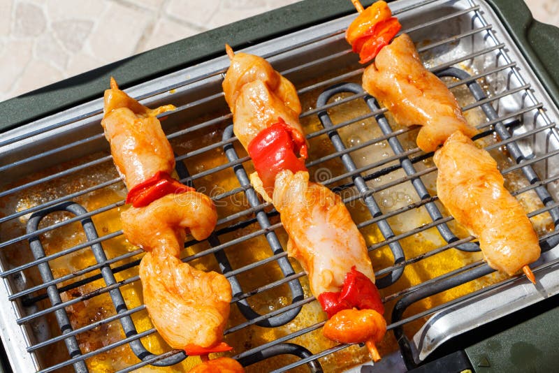 Marinated Chicken Brochette on Electric Barbecue Stock Image - Image of ...