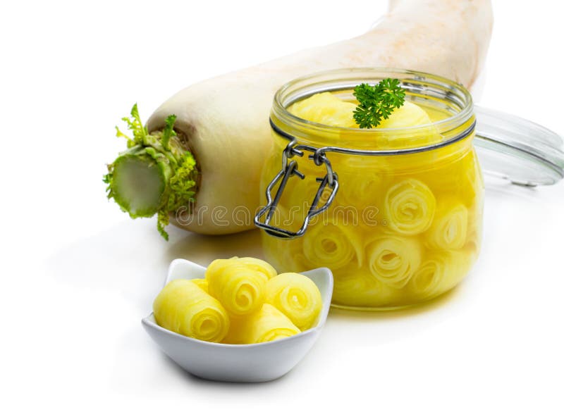 Marinated Daikon on White Background in the Glass Jar Stock Photo