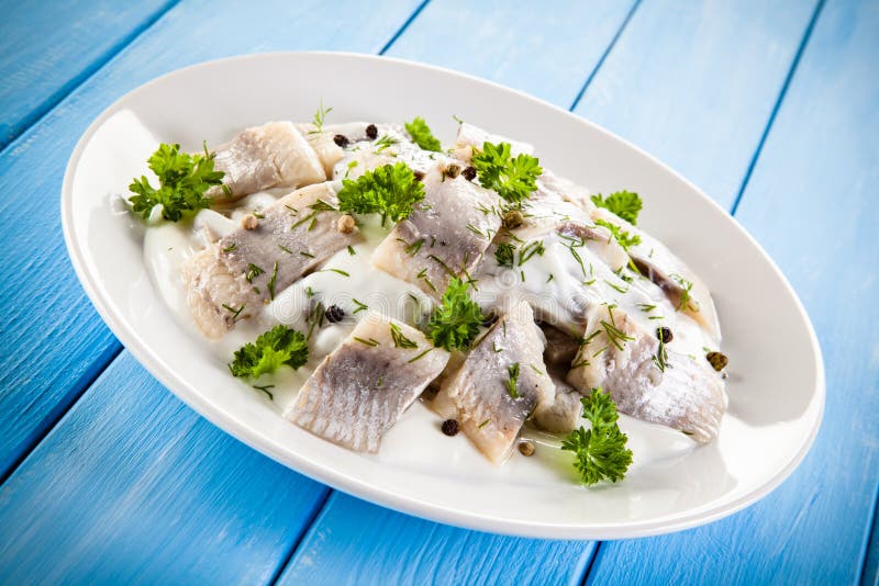 Marinated herring fillets stock image. Image of filets 74372189