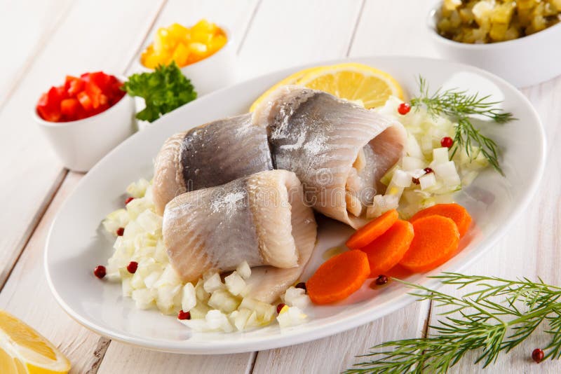 Marinated herring fillets stock image. Image of delicatessen 88436561