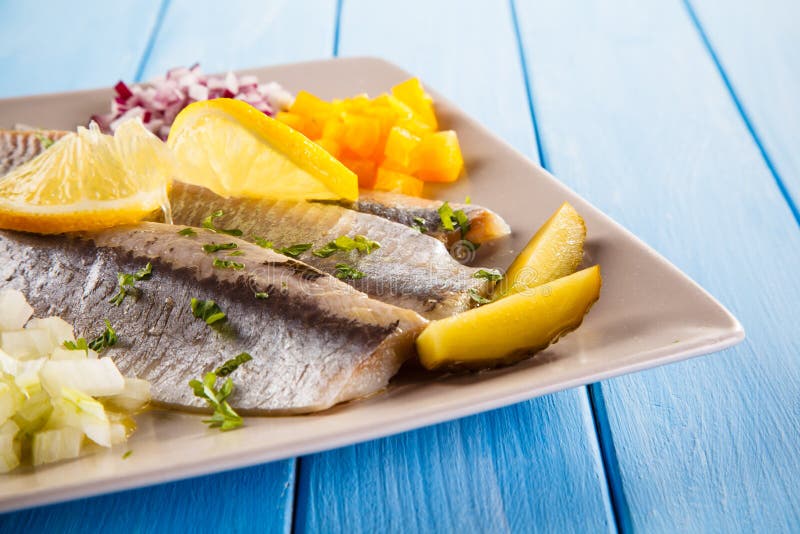 Marinated herring fillets stock photo. Image of omega 116376450