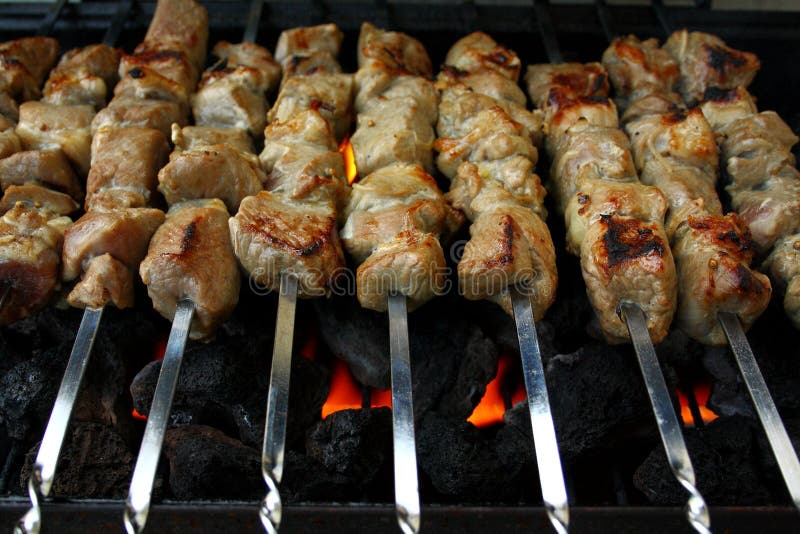 Marinated lamb meat grilling on metal skewer, close up. Roasted skewer grill stock images, royalty-free photos and pictures