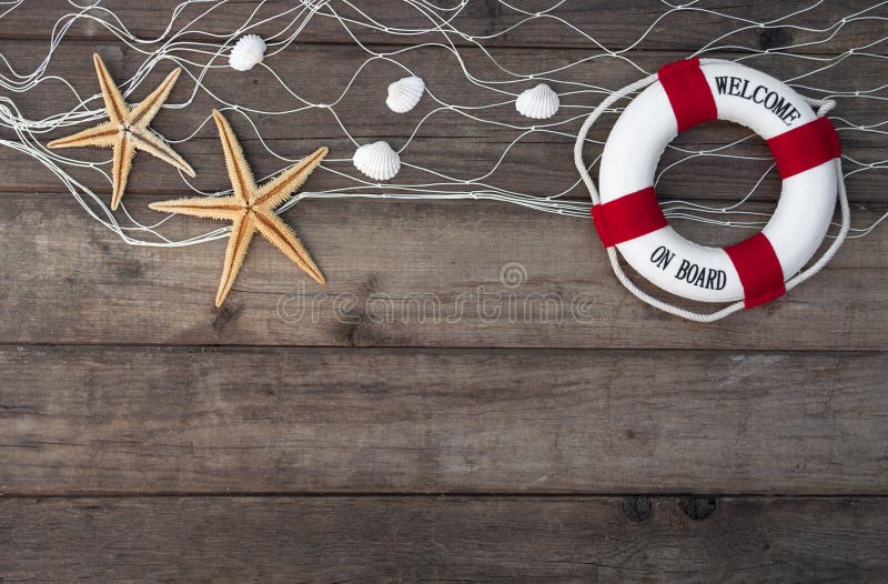 Maritime Decoration with shells, starfish, sailing ship, fishing net on wooden background. Maritime Decoration with shells, starfish, sailing ship, fishing net on wooden background