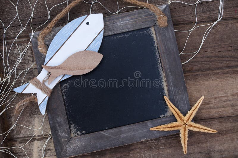 Maritime Decoration with shells, starfish, sailing ship, fishing net on wooden background. Maritime Decoration with shells, starfish, sailing ship, fishing net on wooden background