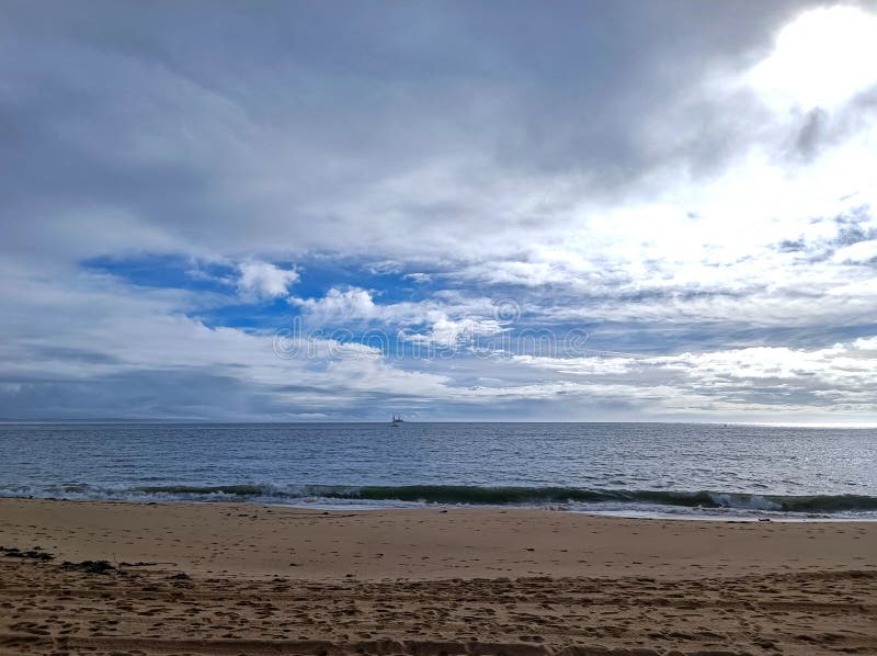 rocks on the beach with cloudy sky. rocks on the beach with cloudy sky